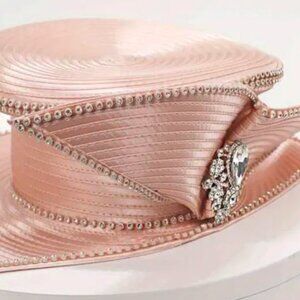 Pink wide brimmed hat with crystal accent.